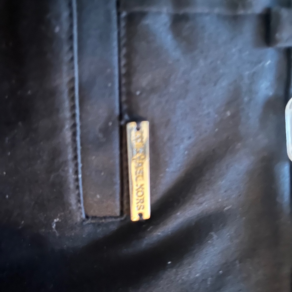 Michael Kors, khaki pants and black